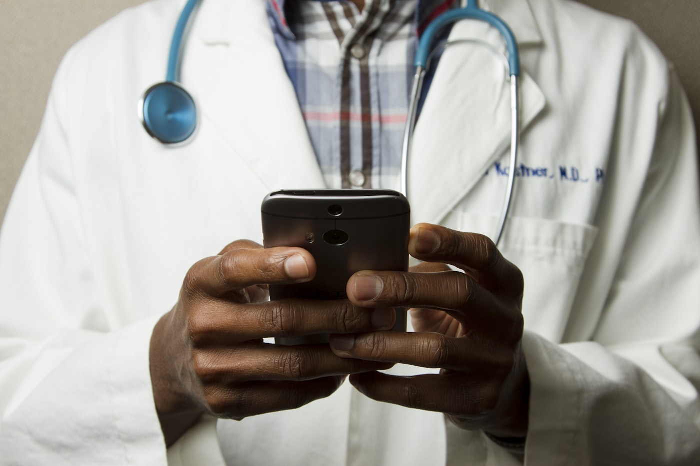 Doctor using a phone for telehealth