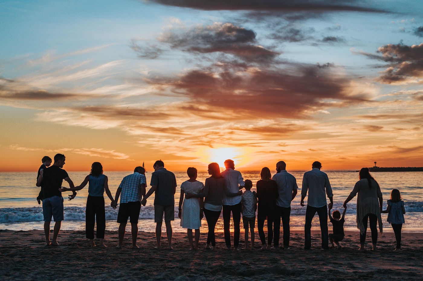 Family at the beach at sunset